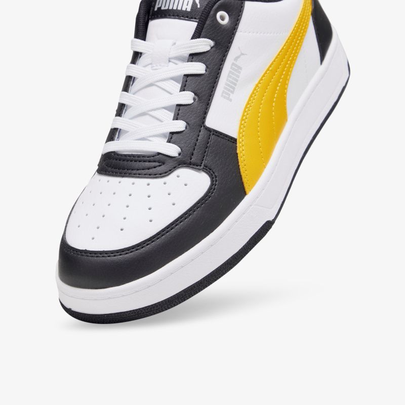 Moderner Sneaker in schwarz, weiß und gelb mit bequemer und langlebiger Verarbeitung für sportlichen Look.