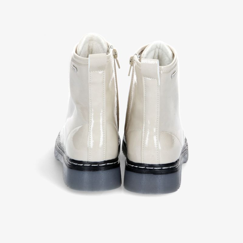 Elegante weiße Stiefel mit kontrastierender Sohle und praktischem Reißverschluss für modernen Stil und Komfort.