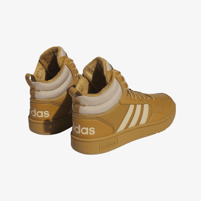 Stylische braune Sneakers mit hohem Schaft und markanten Streifen für optimalen Komfort und modischen Look.