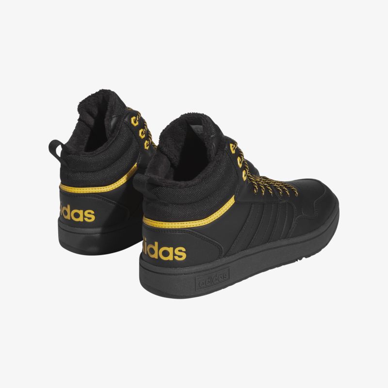 Stylische schwarze Sneakers mit gelben Akzenten und komfortabler Passform, ideal für Freizeit und Sport.