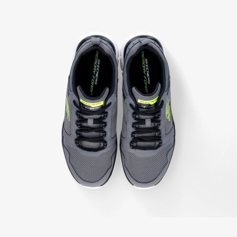 Graue Sneaker mit schwarzer Schnürung und neon Details, bequem und sportlich, ideal für Alltag und Fitness.
