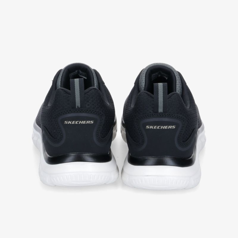 Elegante schwarze Sportschuhe mit weißer Sohle und komfortabler Passform, ideal für aktive Tage.