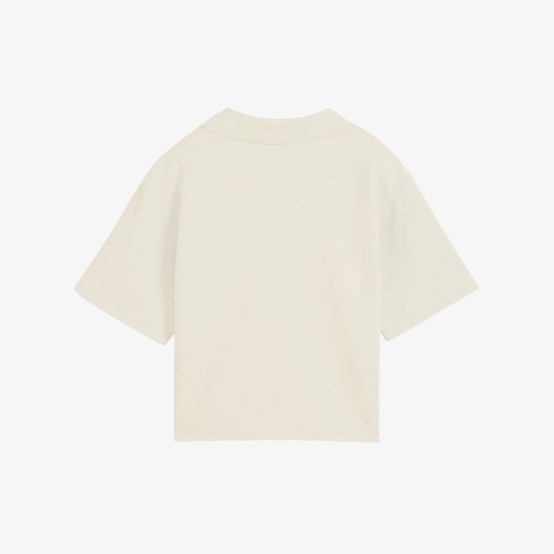 Beige T-Shirt mit lockerem Schnitt und kurzen Ärmeln in klassischer, schlichter Optik von hinten