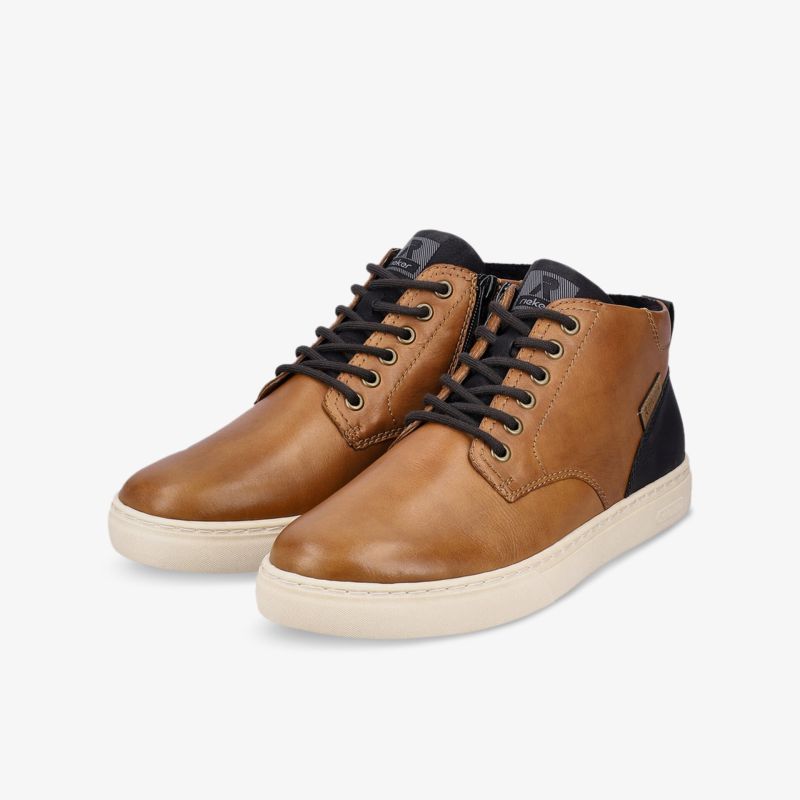 Elegante braune Lederstiefel mit schwarzem Detail und heller Sohle, ideal für lässige und modische Anlässe