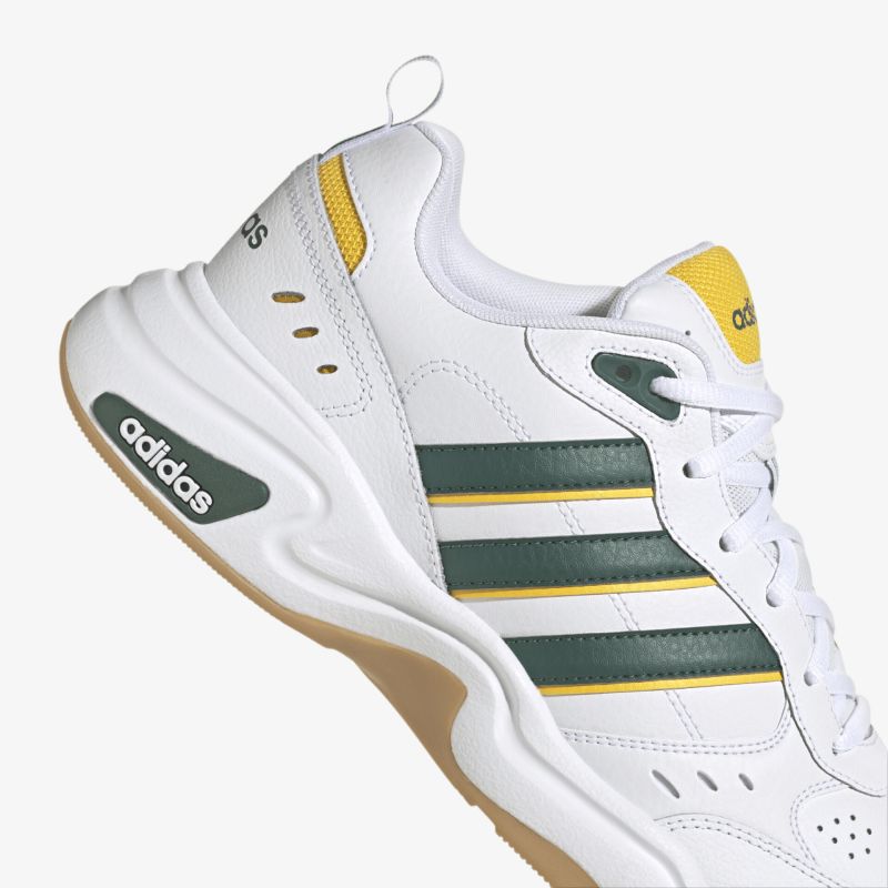 Moderner, sportlicher Sneaker mit rutschfester Sohle und hohem Tragekomfort in Weiß, Schwarz und Gelb.