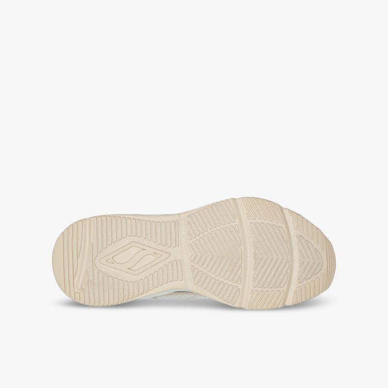 Beige Schuhsohle mit rutschfester und strapazierfähiger Struktur in Nahaufnahme.