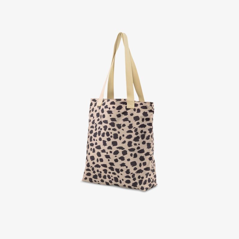 Stilvolle Tasche mit Leopardenmuster und beigen Henkeln, ideal für Alltag und Shopping.