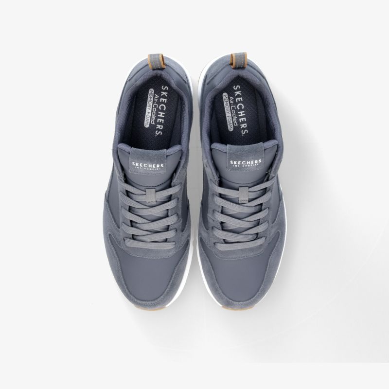 Moderne graue Sneakers mit rutschfester Sohle und atmungsaktivem Design für ultimativen Komfort.