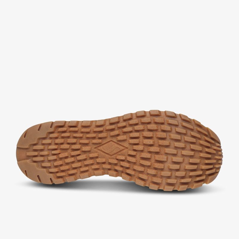 Robuste Gummisohle mit tiefem Profil für optimalen Halt und Stabilität auf vielfältigen Untergründen.