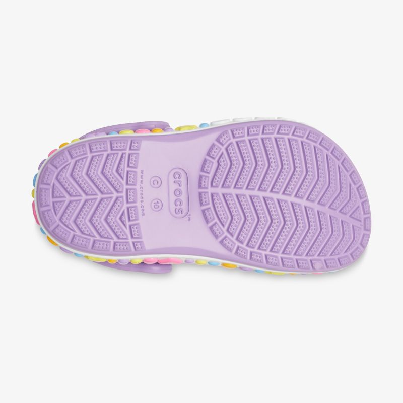 Lila Schuhsohle mit rutschfestem Profil für optimalen Halt und Komfort.