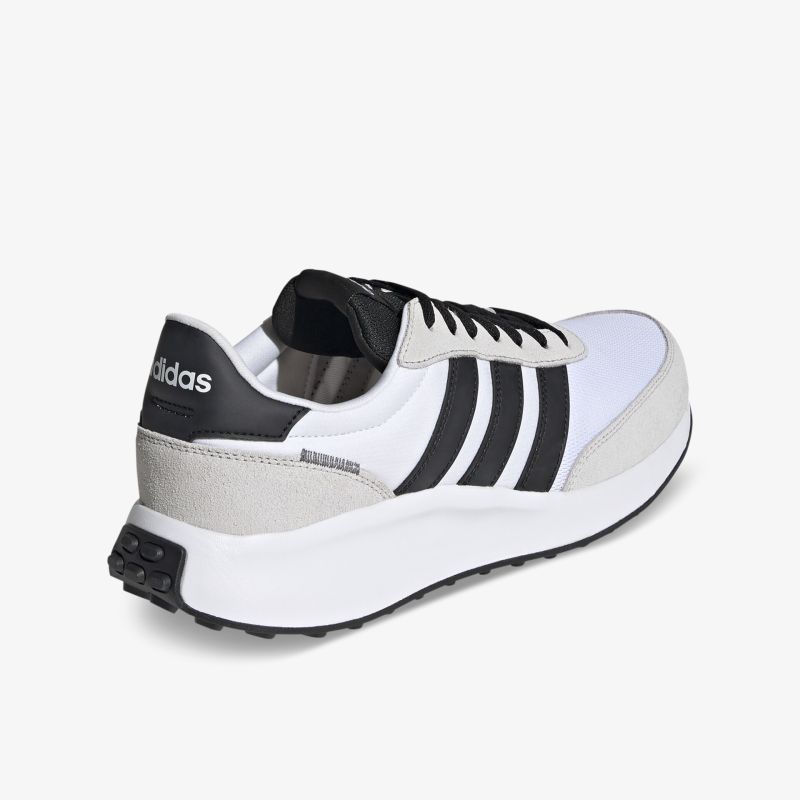 Weißer Sneaker mit schwarzen Streifen und komfortabler Sohle für sportlichen Stil und hohen Tragekomfort.