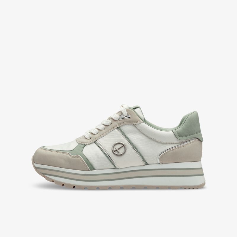 Moderner Sneaker seitlich in neutralen Farben mit gepolstertem Einstieg und robuster Sohle für hohen Tragekomfort
