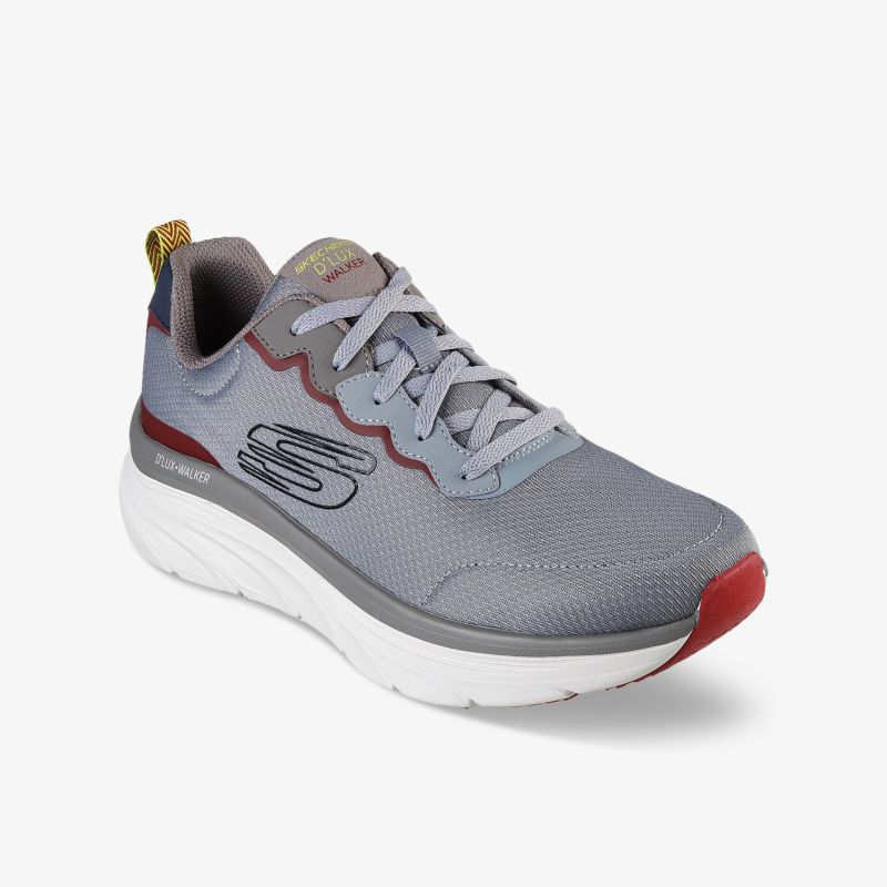 Athletischer, grauer Sneaker mit rotem Akzent, atmungsaktives Mesh, leichte Sohle, hoher Tragekomfort.