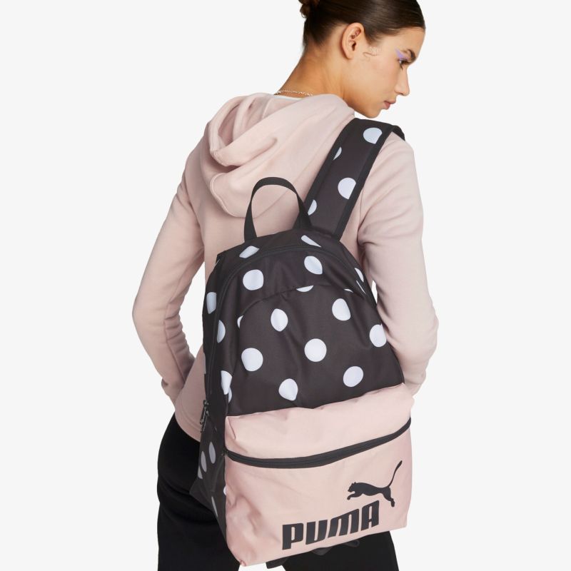 Stilvoller Rucksack mit Polka-Dots, geräumiges Design, ideal für den Alltag.