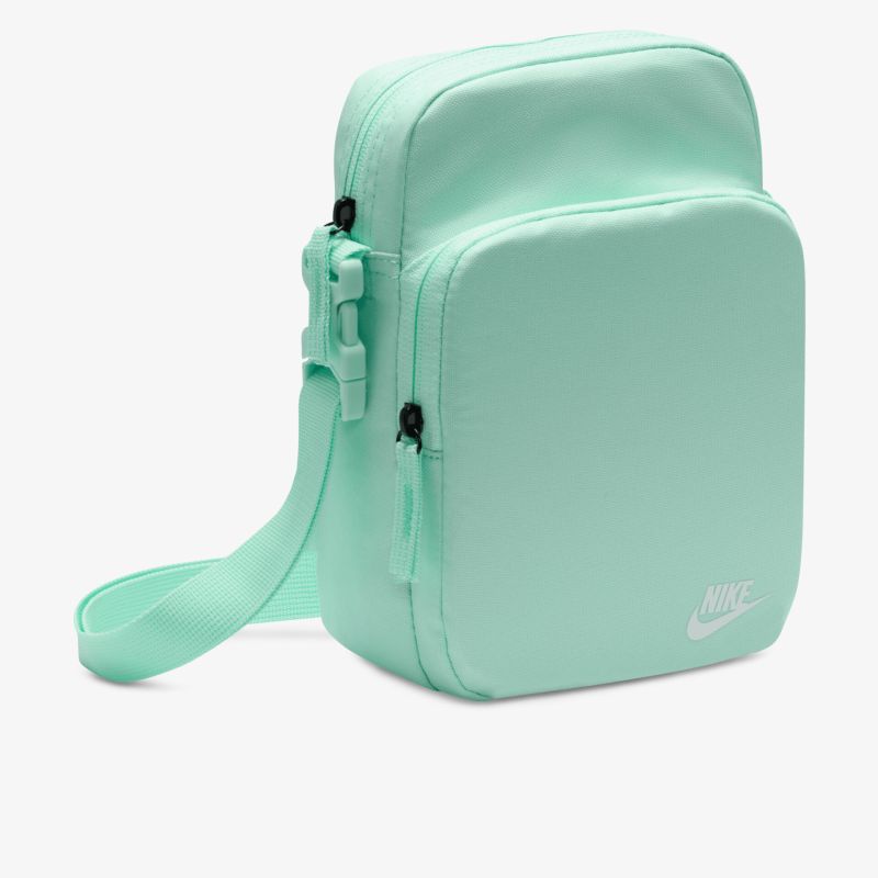 Mintgrüne kompakte Umhängetasche mit verstellbarem Schulterriemen und mehreren Reißverschlussfächern, modernes minimalistisches Design