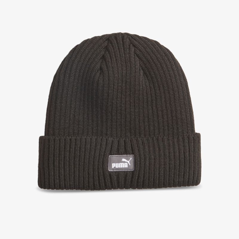 Schwarze Strickmütze mit elastischem Material und sichtbarem Puma Logo, ideal für kaltes Wetter