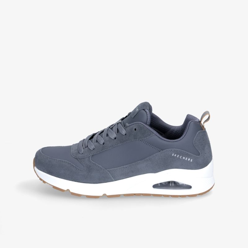 Moderner grauer Sneaker mit weißer Sohle, ideal für Sport und Freizeit. Komfort und Stil für den Alltag.