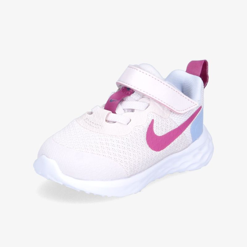 Moderner Sneaker mit auffälligem pinken Swoosh und praktischen Klettverschluss für maximalen Komfort und Style.
