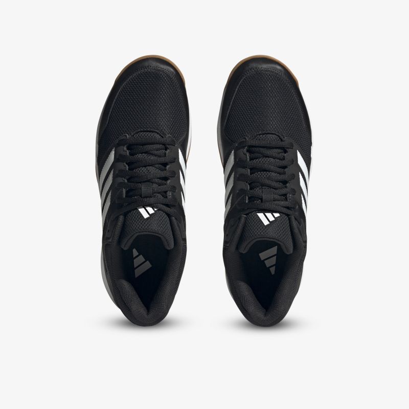 Schwarze Turnschuhe mit weißen Streifen, stylisch und komfortabel für den täglichen Gebrauch.