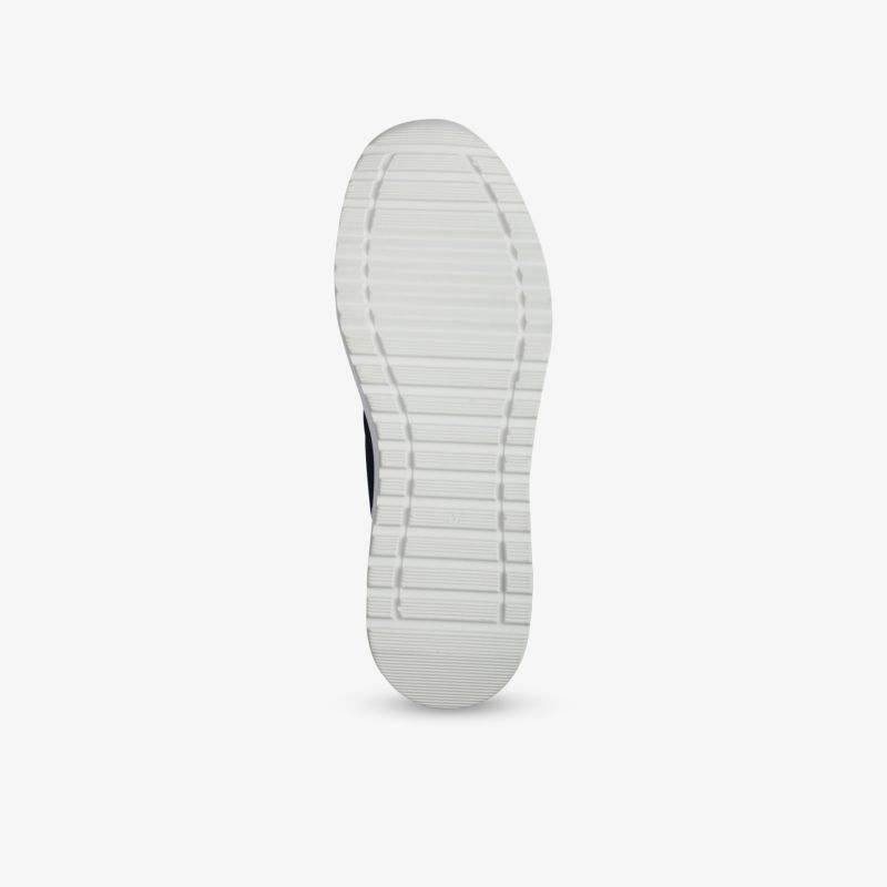 Weiße Schuhsohle mit tiefem Profil für sicheren Halt und langlebige, flexible Nutzung
