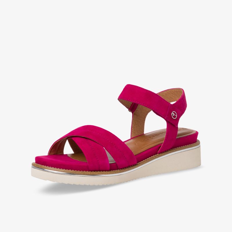 Bequeme Sandale in lebendigem Pink mit gepolsterter Sohle und verstellbaren Riemen für optimalen Tragekomfort.