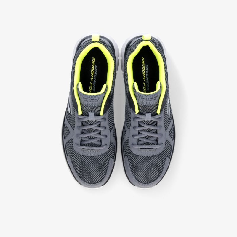 Moderne graue Sneaker mit gelben Akzenten für optimalen Tragekomfort und sportlichen Style.