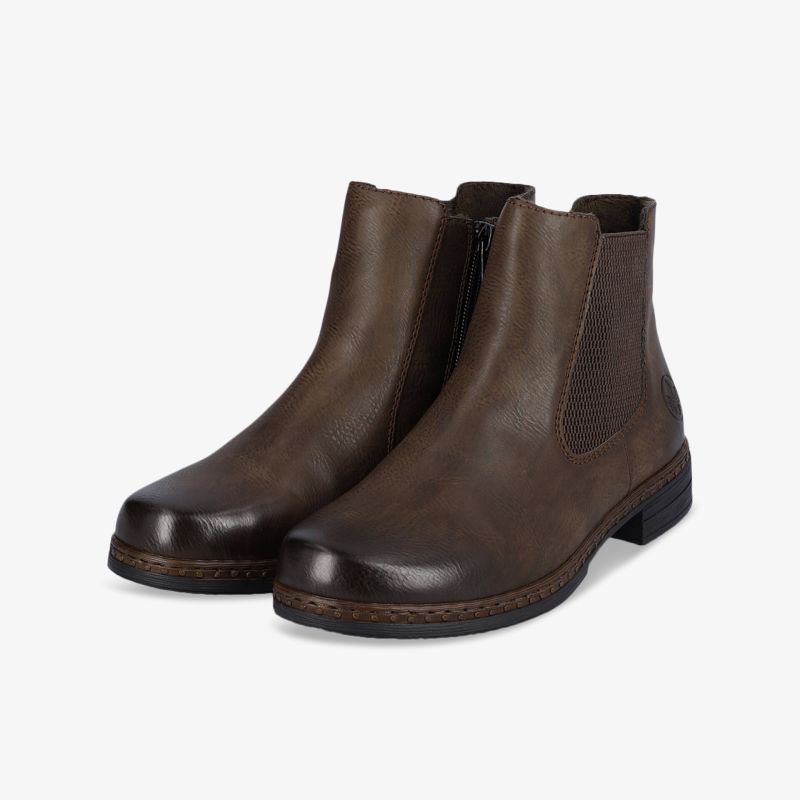 Braune Stiefeletten in Lederoptik mit elegantem Design und rutschfester Sohle. Hoher Tragekomfort und Vielseitigkeit.