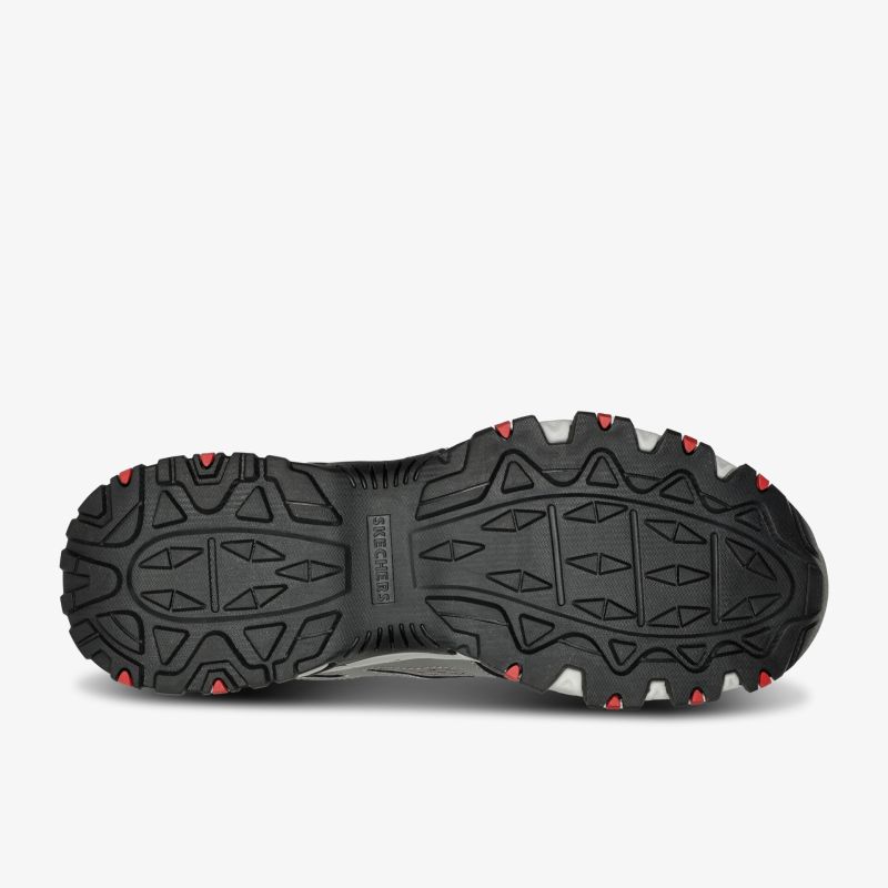 Robuste Sohle mit effizientem Profil für optimalen Halt auf anspruchsvollem Gelände.