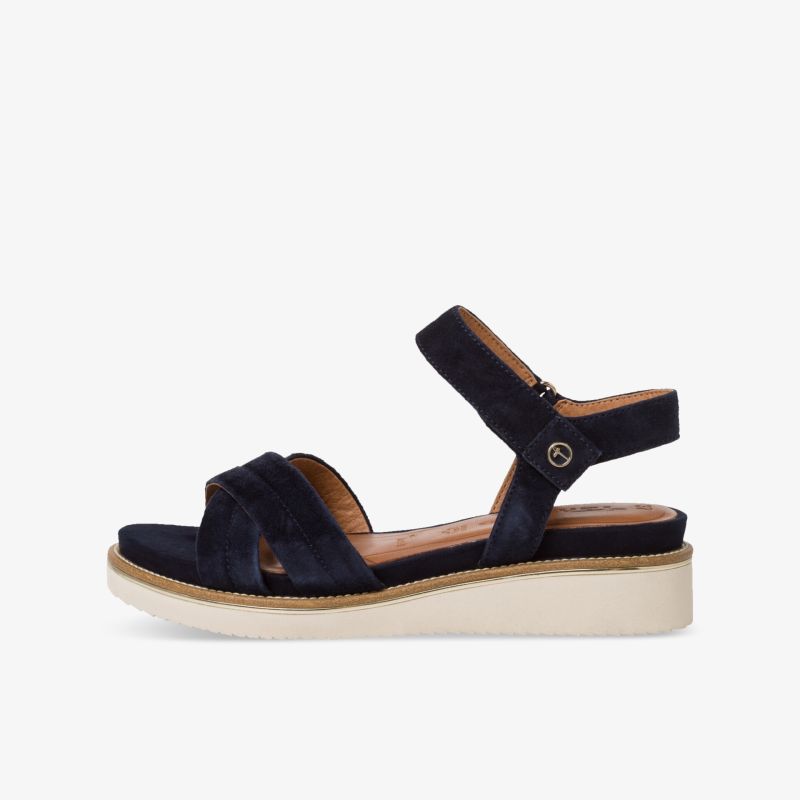Elegante dunkelblaue Sandale mit verstellbarem Riemen und bequemem Keilabsatz für stilvollen Auftritt.