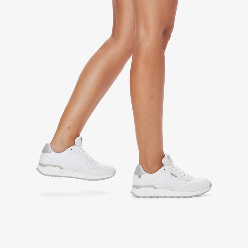 Bequeme, weiße Sneakers mit grauen Akzent, sportliches Design für vielseitige Aktivitäten.