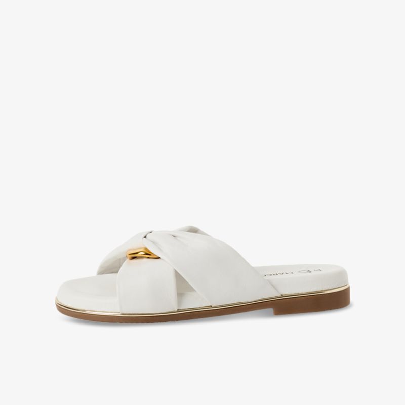 Moderner weißer flacher Sommerschuh mit überkreuztem Riemen für eleganten und bequemen Tragekomfort