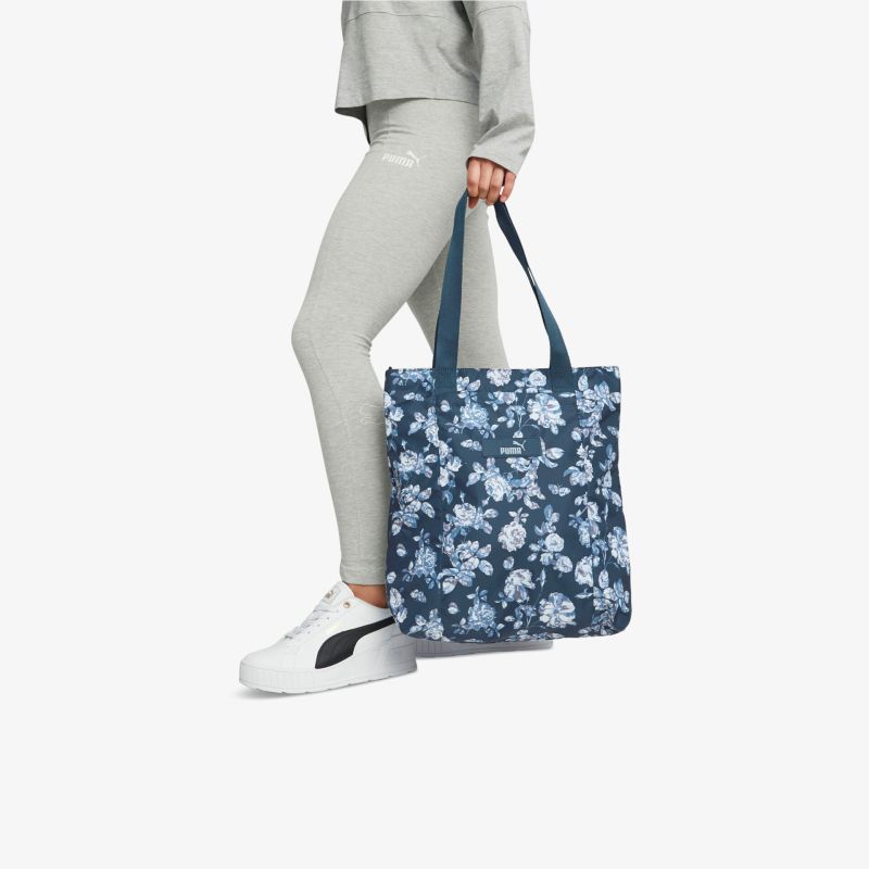 Elegante, blumige Tragetasche mit bequemen Griffen, perfekt für Alltag und Sport.