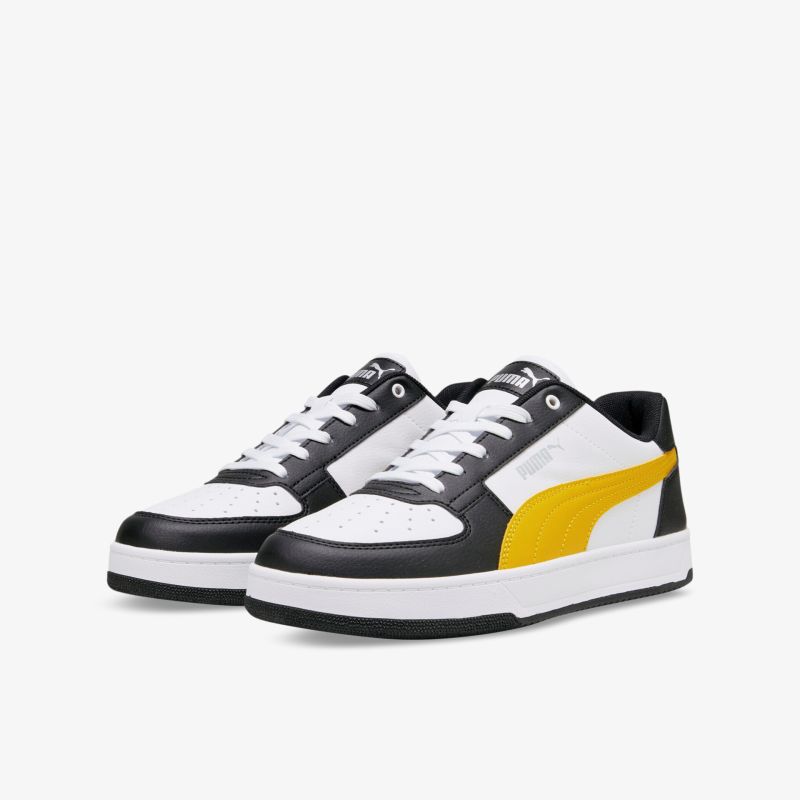 Moderner Sneaker in Weiß mit gelben und schwarzen Akzenten, perfekt für Alltag und Freizeit.