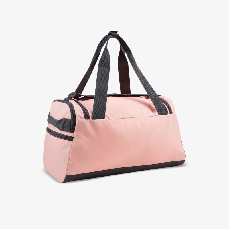 Rosa Sporttasche mit robusten Trageriemen und geräumigem Innenraum, perfekt für Sport und Reisen.