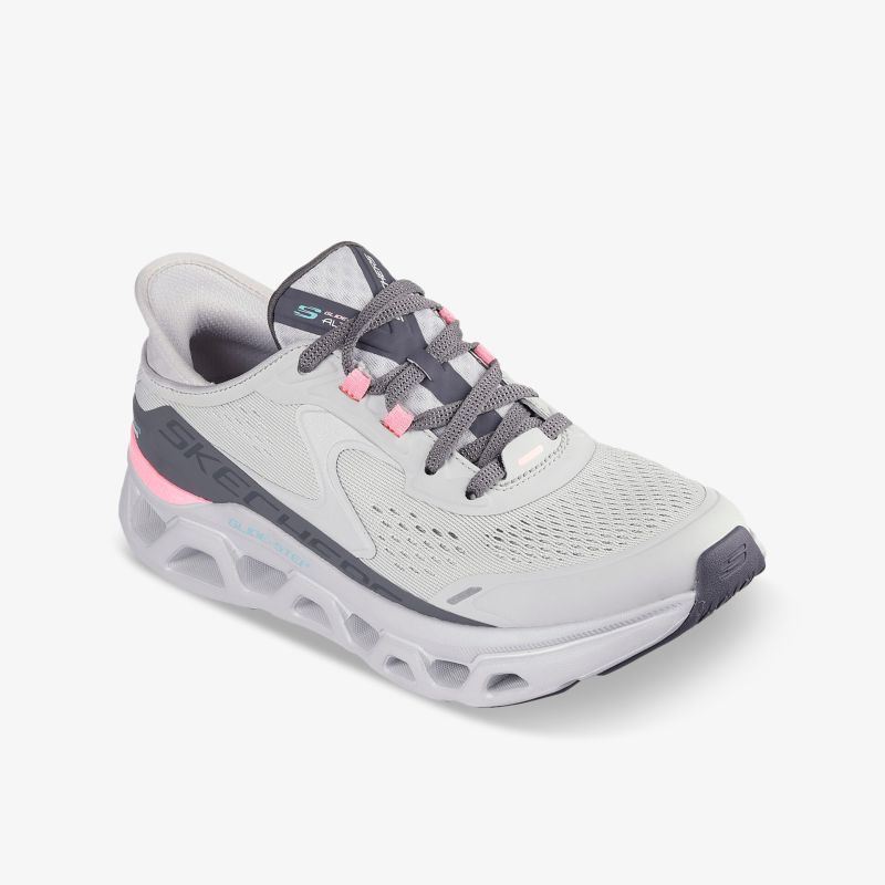 Leichter sportlicher Laufschuh mit atmungsaktivem Obermaterial und stoßdämpfender Sohle in weiß mit pinken Akzenten