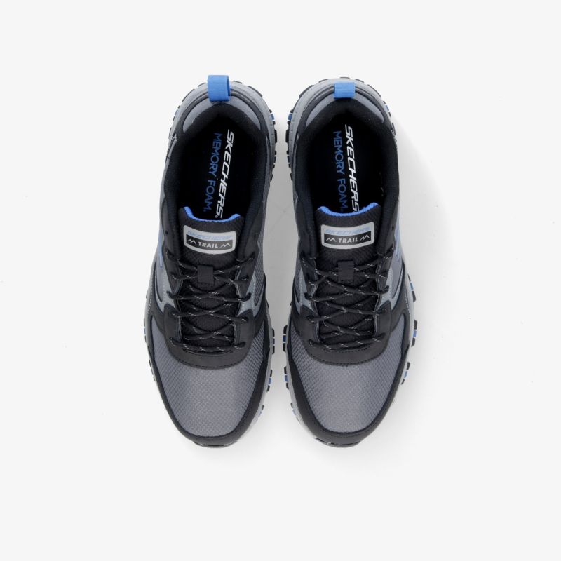 Moderne, bequeme Sneaker in Grautönen mit rutschfester Sohle und sportlicher Optik, ideal für vielseitige Aktivitäten.