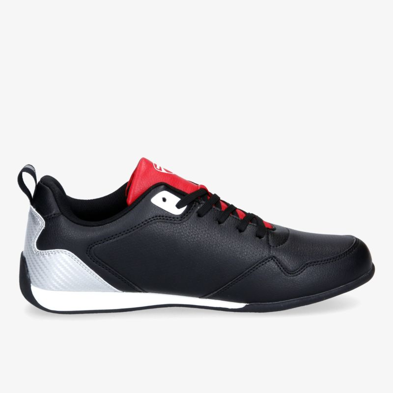 Moderner, schwarzer Sneaker mit rotem Akzent; bequem und stylisch für jeden Tag.