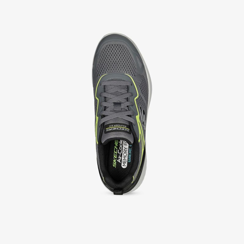 Moderner Schuh mit grauem Obermaterial und Akzenten in Neongelb, ideal für sportliche Aktivitäten