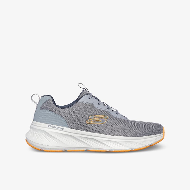 Leichter grauer Sportschuh mit atmungsaktivem Mesh, stoßdämpfender Sohle und modernem Design seitliche Ansicht