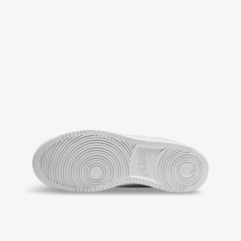 Weiße, griffige Schuhsohle mit kreisförmigem Profil für optimalen Halt und Langlebigkeit.