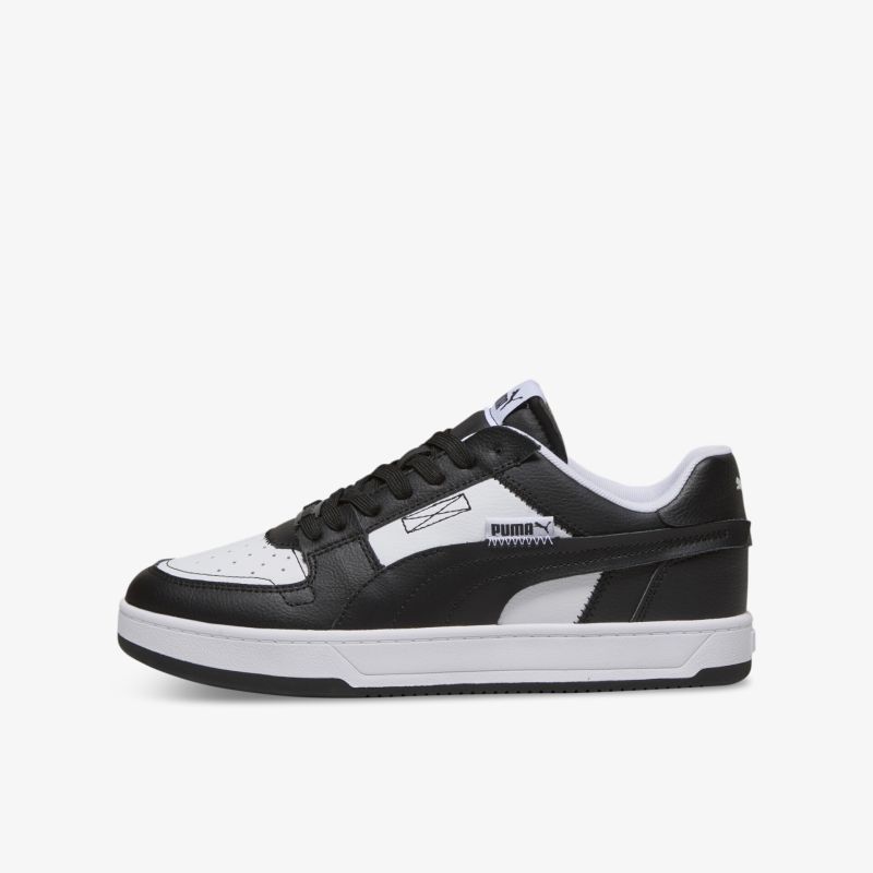 Seitlich sichtbarer schwarz-weißer Sneaker mit modernem Design und komfortabler Gummisohle für angenehmes Tragegefühl