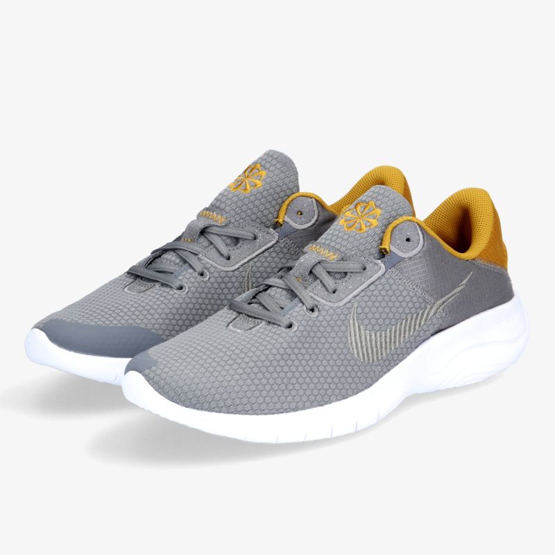 Graue Sneaker mit gelben Akzenten und weißer Sohle, bieten Komfort und Stil für jeden Anlass.