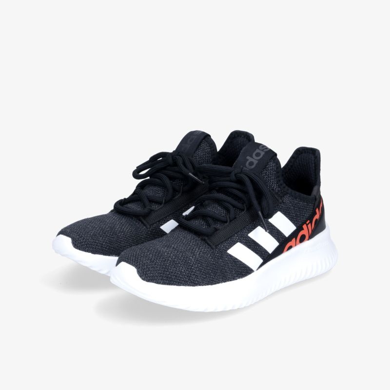 Schwarze Turnschuhe mit weißer Sohle, ideal für Sport und Freizeit.