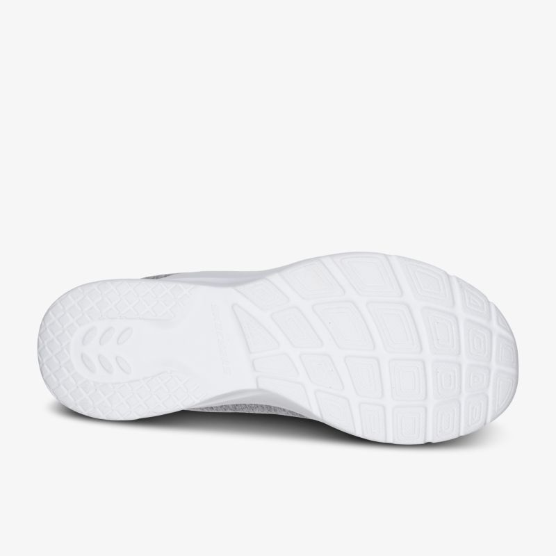 Weiße, ergonomische Gummisohle eines Sportschuhs, rutschfest und langlebig für maximalen Komfort.