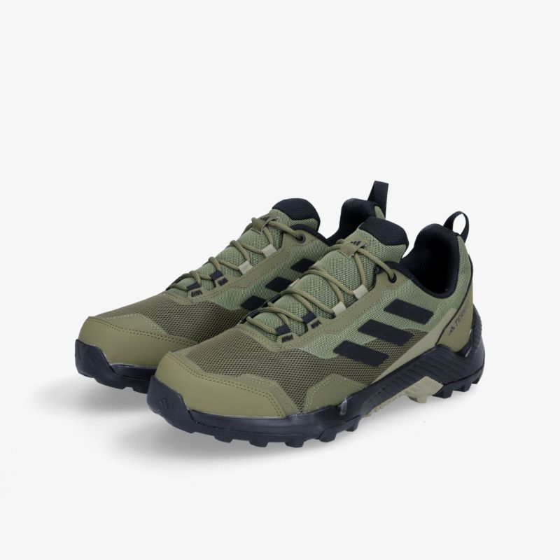 Robuste und bequeme Outdoor-Schuhe in Olivgrün mit rutschfester Sohle und sportlichem Design für vielseitigen Einsatz.
