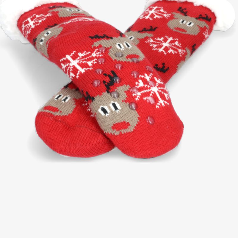Kuschelige rote Socken mit Rentier- und Schneeflocken-Muster für gemütliche Wintermomente.