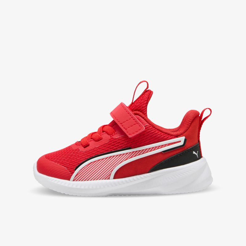 Roter leichter Sneaker mit atmungsaktivem Material, Klettverschluss und rutschfester weißer Sohle seitlich abgebildet