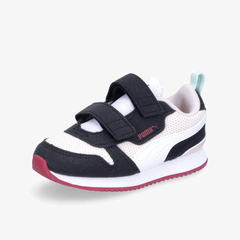 Moderner Sneaker mit Klettverschluss und rutschfester Sohle in Schwarz-Weiß-Rot.