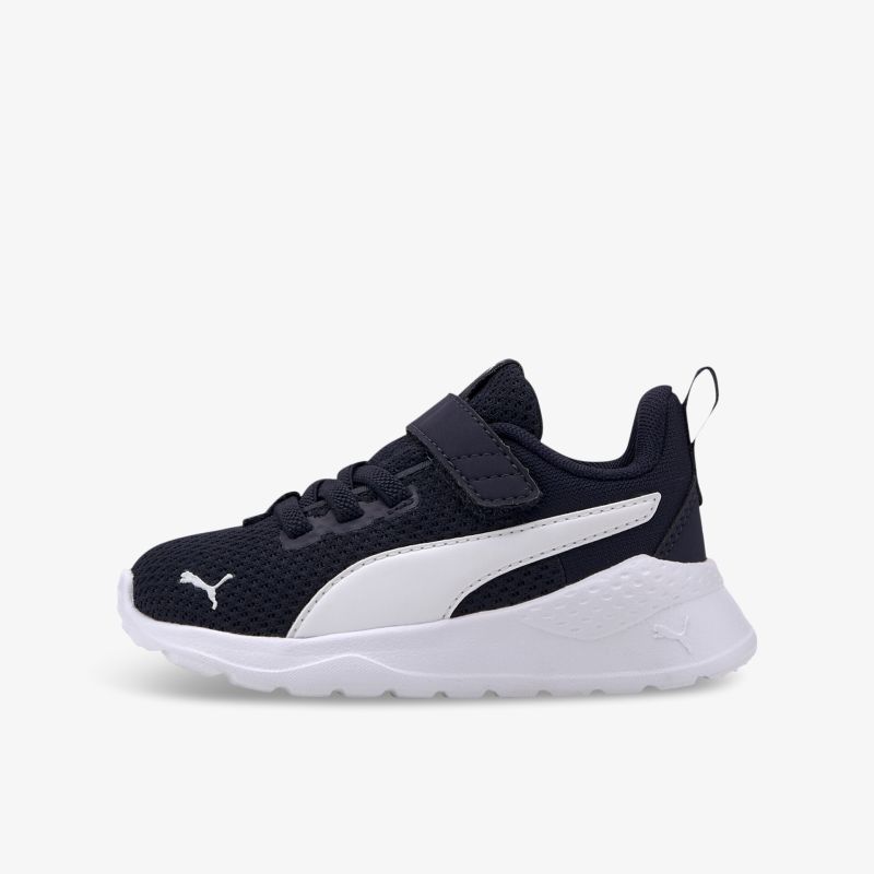 Sportlicher schwarzer und weißer Sneaker mit Klettverschluss, ideal für bequemen und stylischen Auftritt.