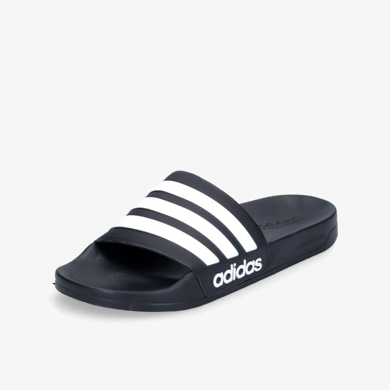Bequeme schwarze Slides mit markanten weißen Streifen und Adidas-Logo für Freizeit und Komfort.